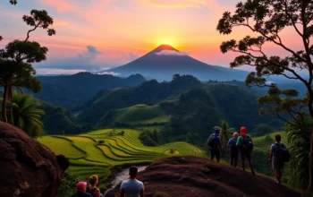 Hikers overlooking Mount Rinjani at sunrise with lush green landscape and vibrant sky